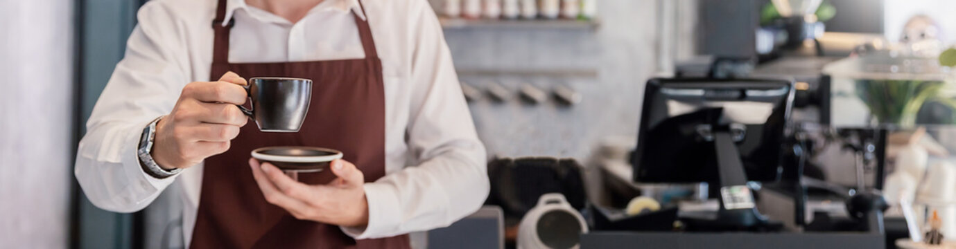 Startup successful small business owner sme man use coffee machine  hand holding coffee mug shot in coffee shop restaurant.  SME entrepreneur business