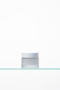Abstract cream jars on the bath shelf, luxury cosmetic product for self-care, natural glow, and spa-inspired facial rejuvenation. Copy space