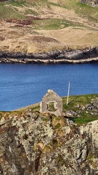 Aerial view of the remaining wall of the old coastguard station in Teelin, County Donegal, Ireland