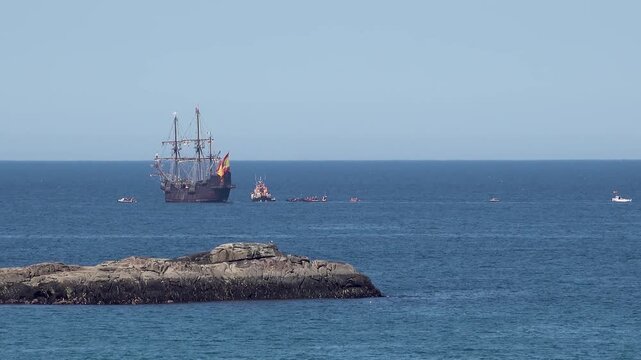 Historic Galleon with Spanish flag sailing close to the coast of Ireland in County Donegal