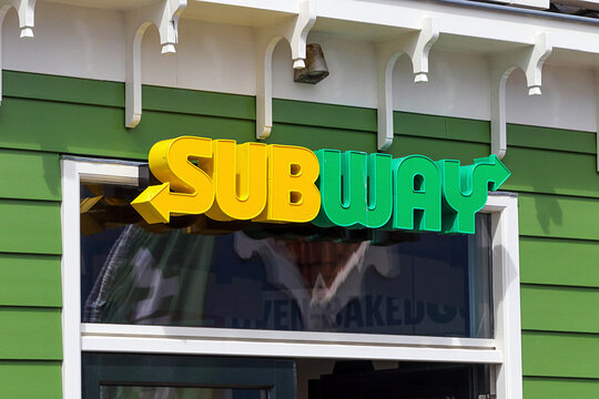 Subway restaurant sign on green facade in Zaandam Netherlands