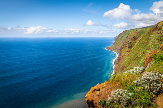 Magnificent seaside steep green slopes in Madeira Island, Portugal