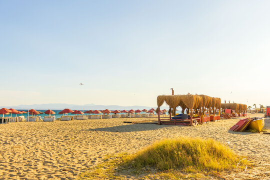 Beach lounge on cunda island coast. Concept of recreation, hospitality, wellness, vacation and coastal lifestyle.