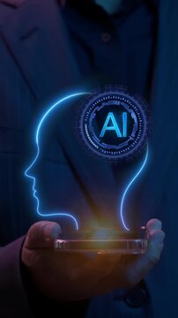 Cropped vertical shot of businessman holding glowing digital human head profile with AI processor brain icon inside. Artificial intelligence neural network and human mind computing concept.