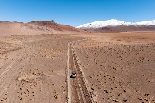 Aerial view of a vehicle crossing a vast desert plain, Sud L&iacute;pez, Potos&iacute;, Bolivia