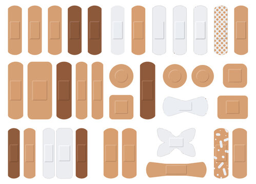 Set of adhesive bandages in various skin tones. 