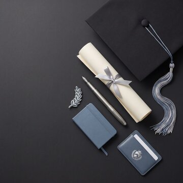 Graduation Cap Diploma and Academic Accessories on Dark Background