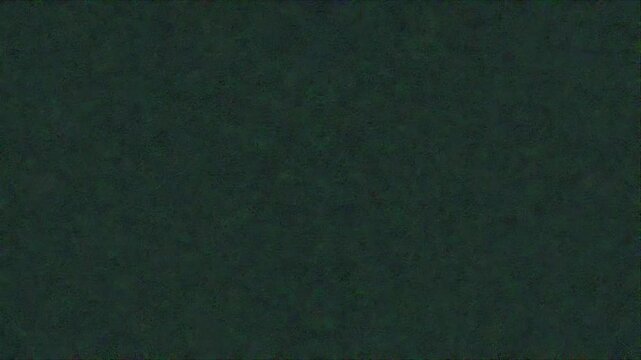 Dark green textured background surface provides a solid deep earthy tone for abstract concepts
