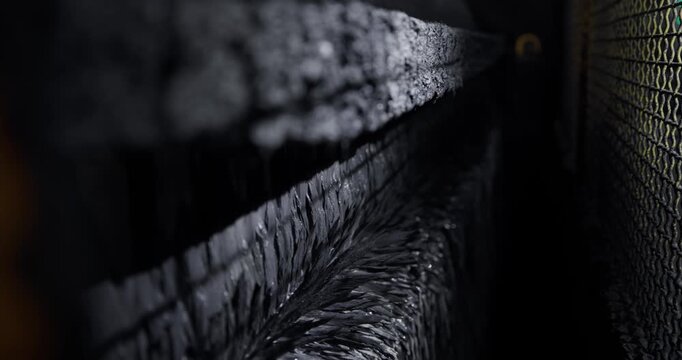 Closeup process Magnetite extraction from pulp is based on wet magnetic separation with permanent magnets or electromagnets on iron production, industry ore mining factory.