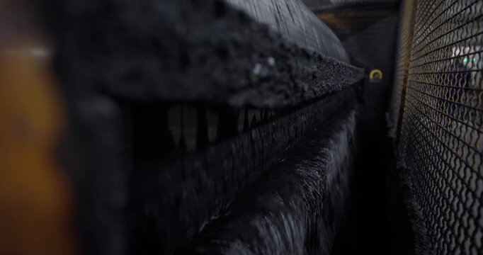 Closeup process on Industry ore mining factory. Magnetite extraction from pulp is based on wet magnetic separation with permanent magnets or electromagnets on iron production.