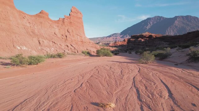 4K drone aerial view of Las Ventanas in Cafayate, Salta, Argentina. Unique red rock formations with natural openings shaped by erosion in the dramatic Quebrada de las Conchas landscape.