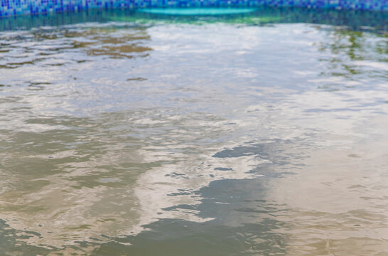 The water in the pool is dirty. Selective focus.