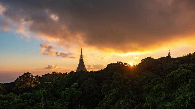 Time lapse of the sunset behind mountain peak in Chiangmai, Thailand.