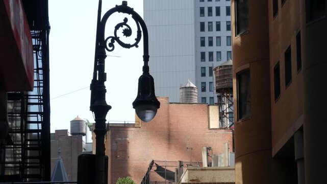 New York City urban building architecture, Manhattan rooftop, United States of America. Water tower on roof. Classic water tanks and lantern.