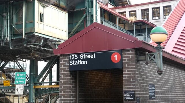 New York City 125 street elevated subway metro entrance in Harlem, United States. American passenger transport, Upper Manhattan. Metropolitan station in NYC USA. Historic architecture, metallic bridge