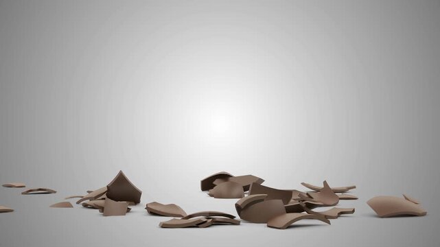 A smooth chocolate brown egg stands upright, suddenly shatters into scattered fragments, and settles across a minimal gray studio backdrop in 3D animation
