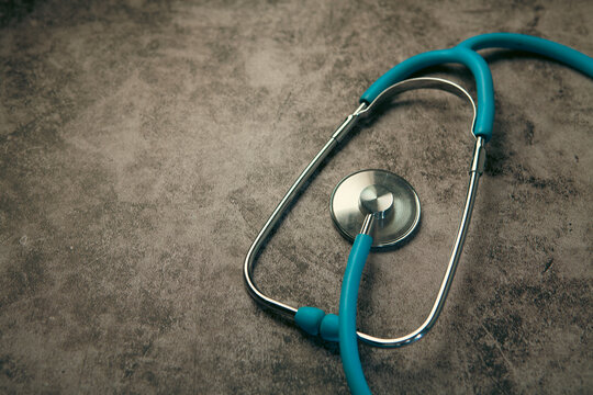Stethoscope on concrete background with filter effect retro vintage style.
