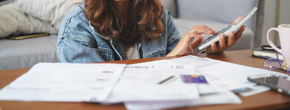 Financial household debt economy accounting concept. Close up view hands of person calculating monthly expense and management investment and payment bill invoice.