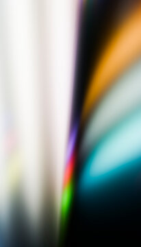 A multicolored abstract background with smooth blurred light