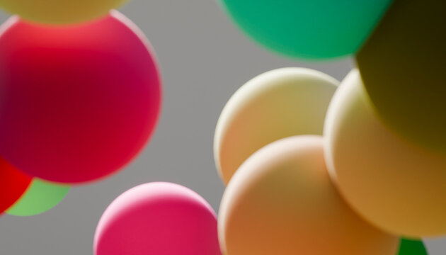 Colorful balloons floating against a gray sky background