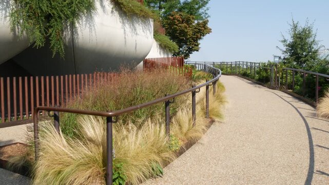 New York City Little Island pier park in Midtown of Manhattan, United States. Urban garden oasis on pillars in Chelsea, USA. Biophilic futuristic contemporary design, eco flora, plants and greenery.