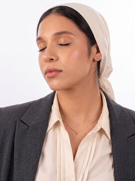 Businesswoman in Headscarf Relaxing with Eyes Closed