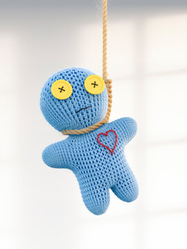 Voodoo doll hanging on rope, 3d rendering