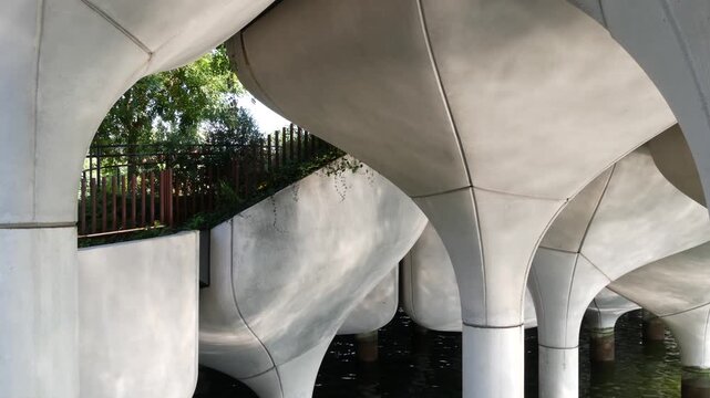 New York City Little Island pier park in Midtown of Manhattan, United States. Urban garden oasis on pillars in Chelsea, USA. Biophilic futuristic contemporary design, eco flora, plants and greenery.