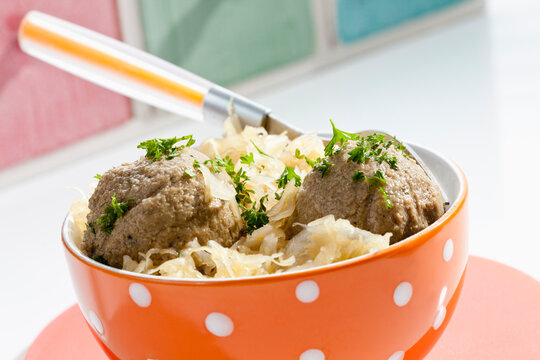 Bowl of liver dumplings with sauerkraut, close up