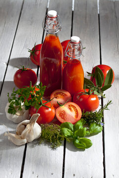 Homemade tomato juice on wooden table