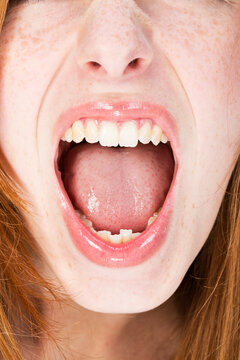 Young woman shouting, close up
