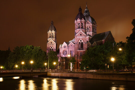 Germany, Bavaria, Munich, View of st lukas church by river isar at night