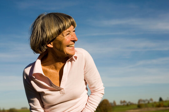 Senior adult woman, looking away, close-up