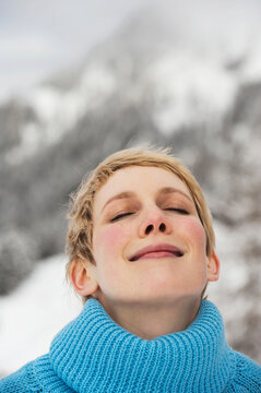 Italy, South Tyrol, Young woman, eyes closed, portrait