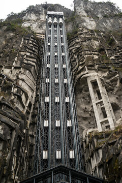 Cliffside Glass Elevator .Towering Elevator At Wulong Krast National Geology Park Chongqing China. provides awe-inspiring panoramic views of the stunning karst landscape with isolate white background.