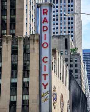 New York, New York, USA - June 14, 2026: A street-level view of the historic Radio City Music Hall sign, located in Midtown Manhattan.