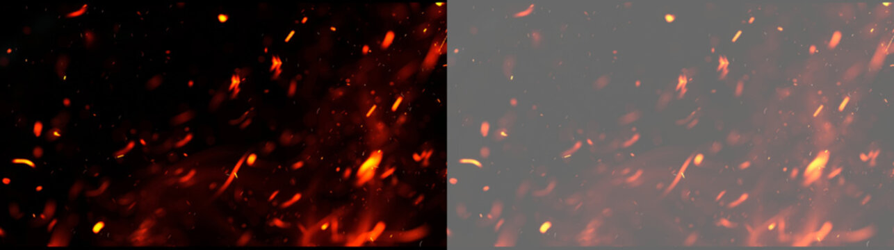 Realistic red glowing fire flames with flying embers and hot sparks isolated on transparent background. Fiery particle effect with burning ash for creative photo and overlay.
