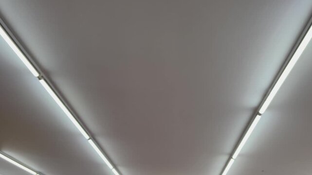 Modern minimalist drop ceiling interior with hidden LED cove lighting