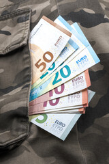 Obraz premium Cash for the military, euro banknotes. 