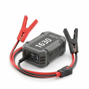 Portable car jump starter power bank with jumper cables and digital display isolated on white background