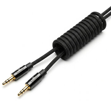 Closeup of a braided black audio cable with two 35mm goldplated jack connectors and a coiled section, isolated on white background