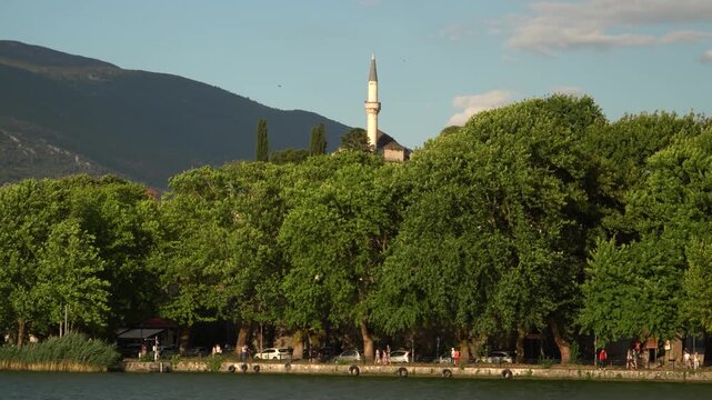 Ioannina Lakeside View Landscape, People Walking Near Lake Urban Nature with Old City, Aslan Pasha Building in Background, Eye Level Shot, Epirus, Greece