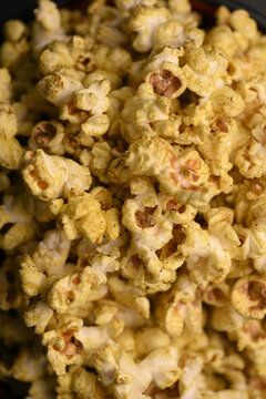 Golden Seasoned Popcorn Macro Background With Crispy Snack Texture Close Up