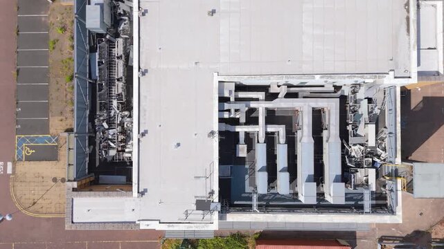An aerial drone view of a decommissioned  data centre after the removal of cooling equipment on the roof