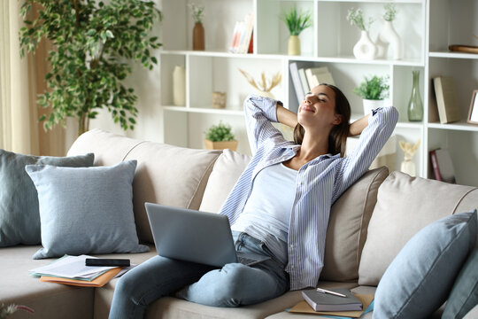 Proud and satisfied teleworker resting and relaxing at home