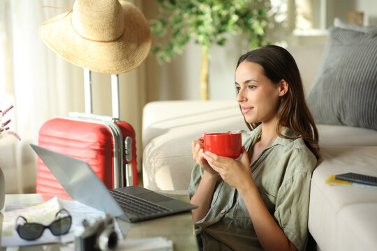 Satisfied tourist driking coffee and contemplating on vacation