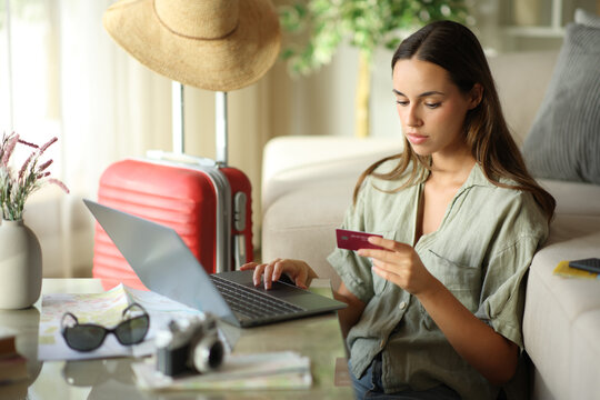 Tourist booking online holding card on vacation
