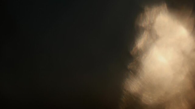 Golden abstract light leak gradient glowing flare sunlight refraction with radiance illumination lens effect. Artistic and dynamic background for futuristic design with copy space.