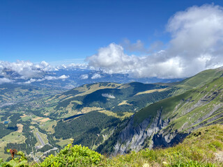 Obraz premium Wide mountain and Megeve view over valleys from alpine ridge in Les Contamines-Montjoie, France