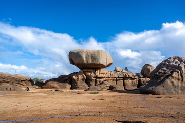 Balanced granite block above sculpted rocks in Tregastel, Brittany, France © daboost
